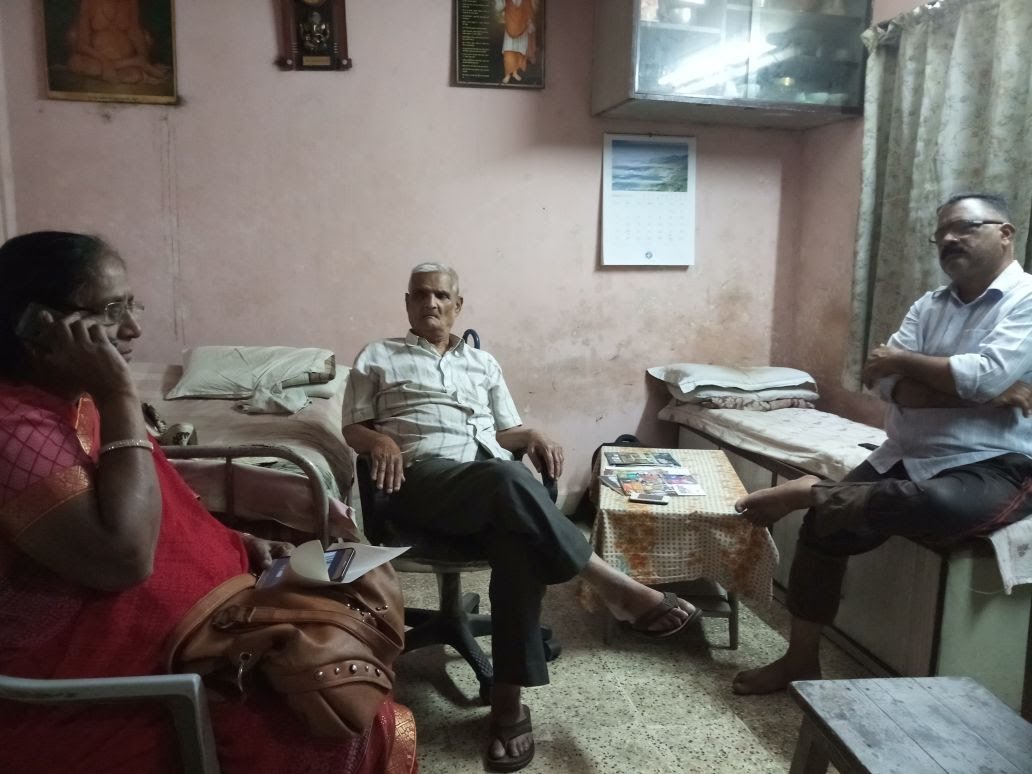 Caregiver and elderly client smiling together